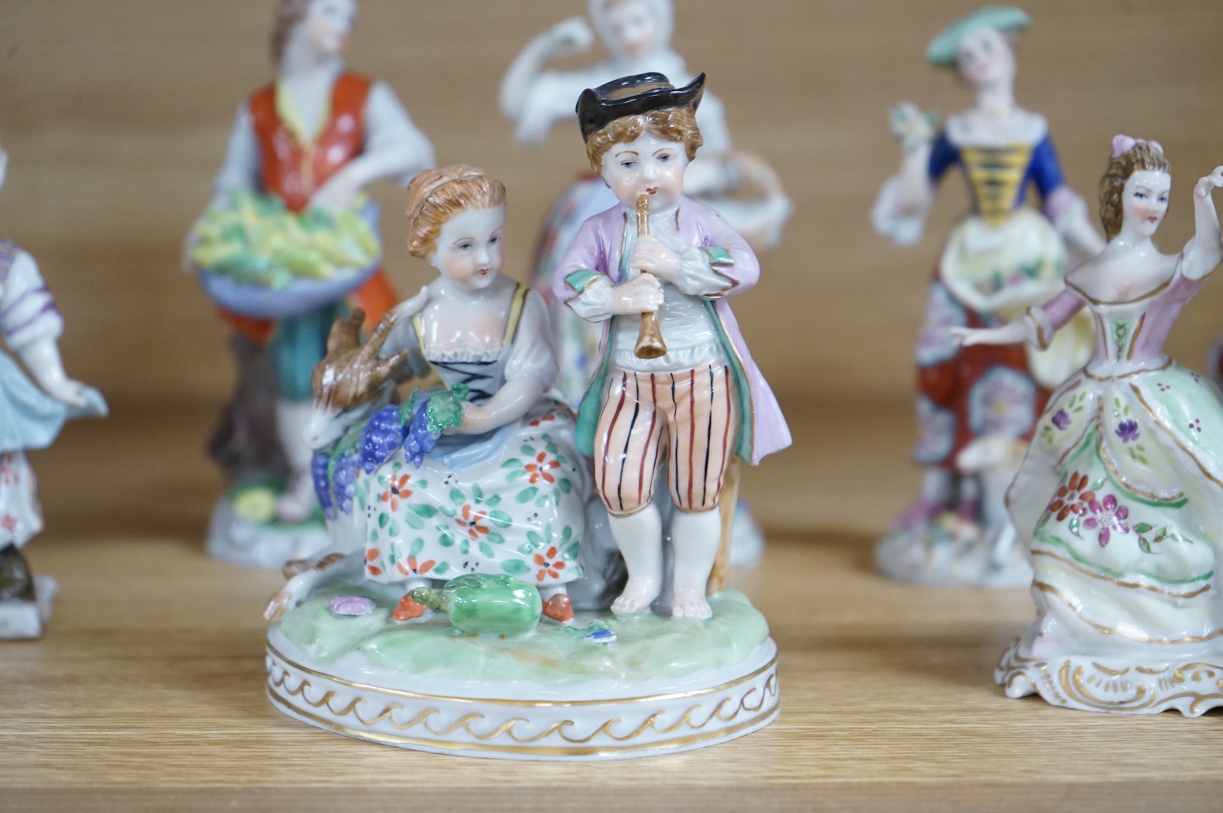 A collection of ten German and English porcelain figures and figure groups, mainly late 19th century, to include Dresden, largest 17cm high